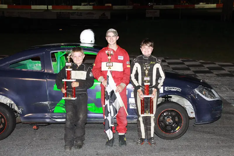 Smiling kids celebrate race victory