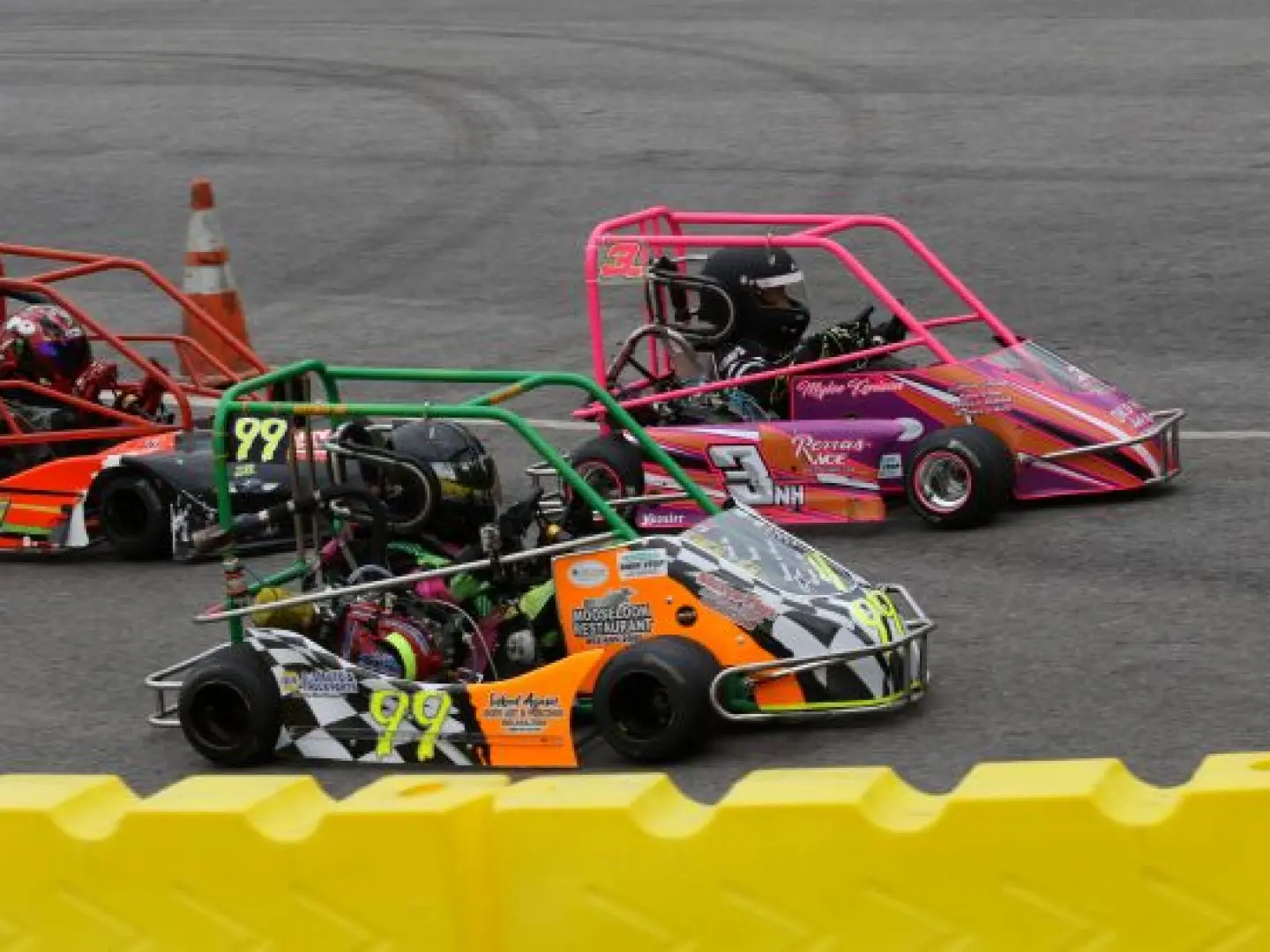 Colorful go-karts on racetrack