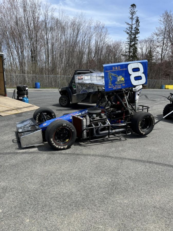 Blue race car with large number eight